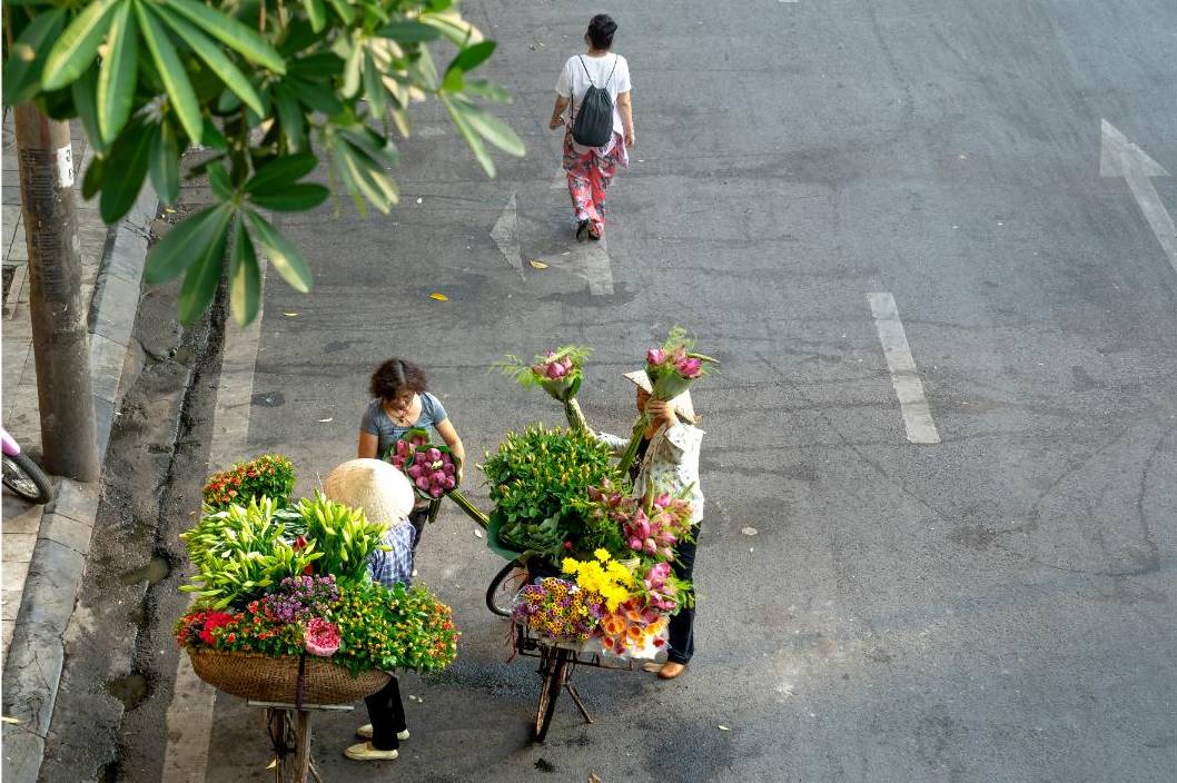 Delivery driver loading van with flowers